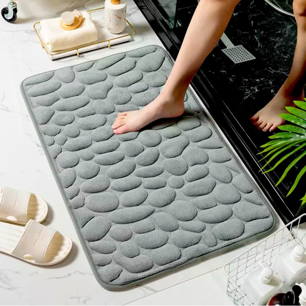 Stone shaped bathroom floor mat.